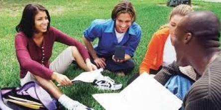 The image showing the showing students learning the French language among themselves