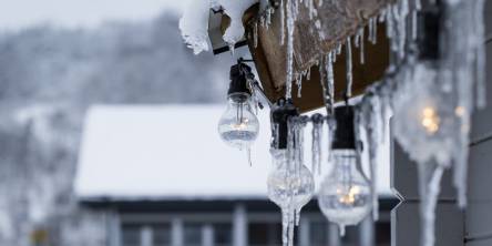 Icicles hanging from the roof of a house,