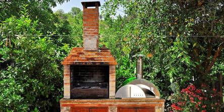 Red Brick Pizza Oven With Chimney In Garden