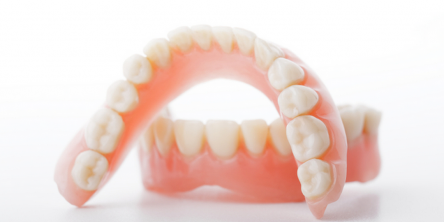Choosing Between a Fixed Bridge and Removable Dentures