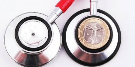 A stethoscope with a coin on top of it