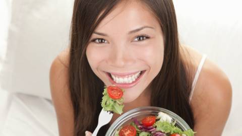 Happy Woman Eating Salads