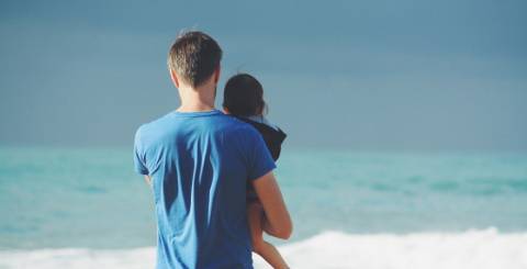 Man and daughter on the beach