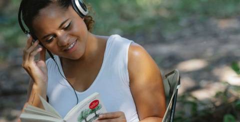 Woman Reading Book In Headphone Woman Reading Book In Headphone