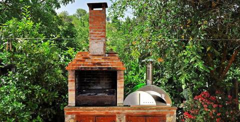 Red Brick Pizza Oven With Chimney In Garden