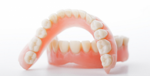 Choosing Between a Fixed Bridge and Removable Dentures