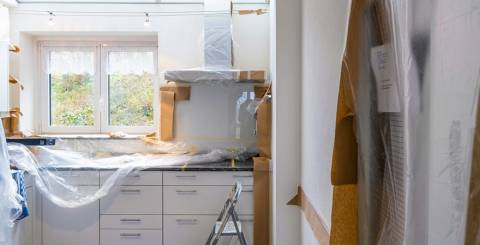 White wooden cabinet near window