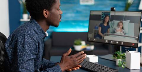 black man using intenet online teleconference video call