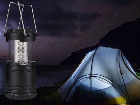 Lamp With Steel Handle Next To Tent