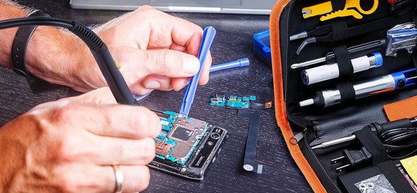 Man Soldering Wires